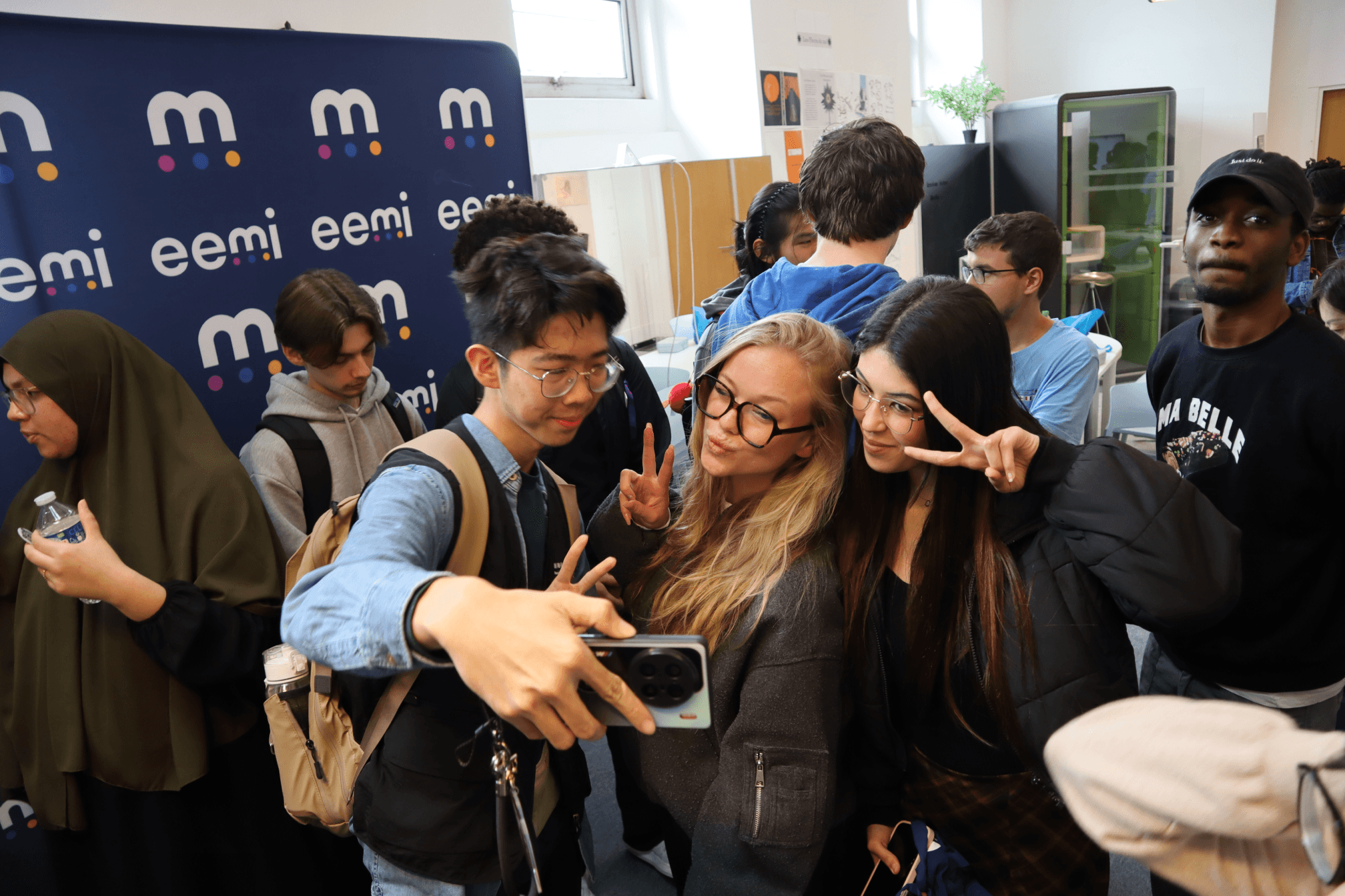A Outbound Student taking a photo with internal students during a exchange program